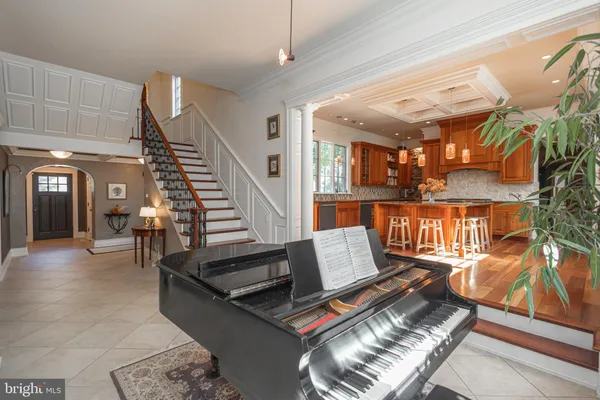 a kitchen with stainless steel appliances granite countertop a sink a stove and a wooden cabinets