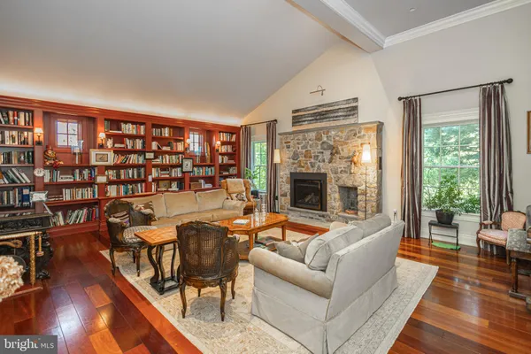a kitchen with stainless steel appliances granite countertop a sink and a wooden floors