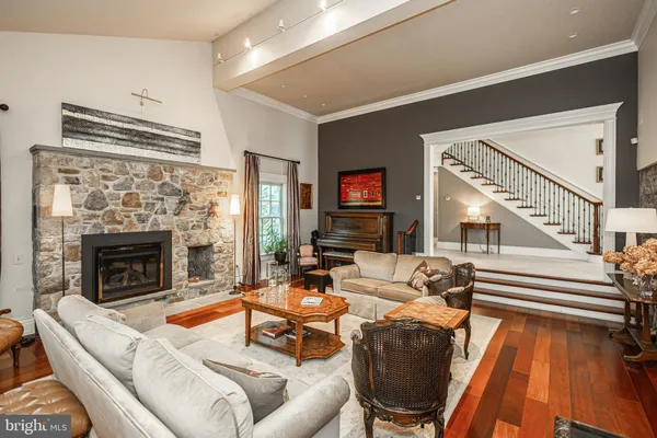 a dining hall with stainless steel appliances granite countertop a stove and a sink