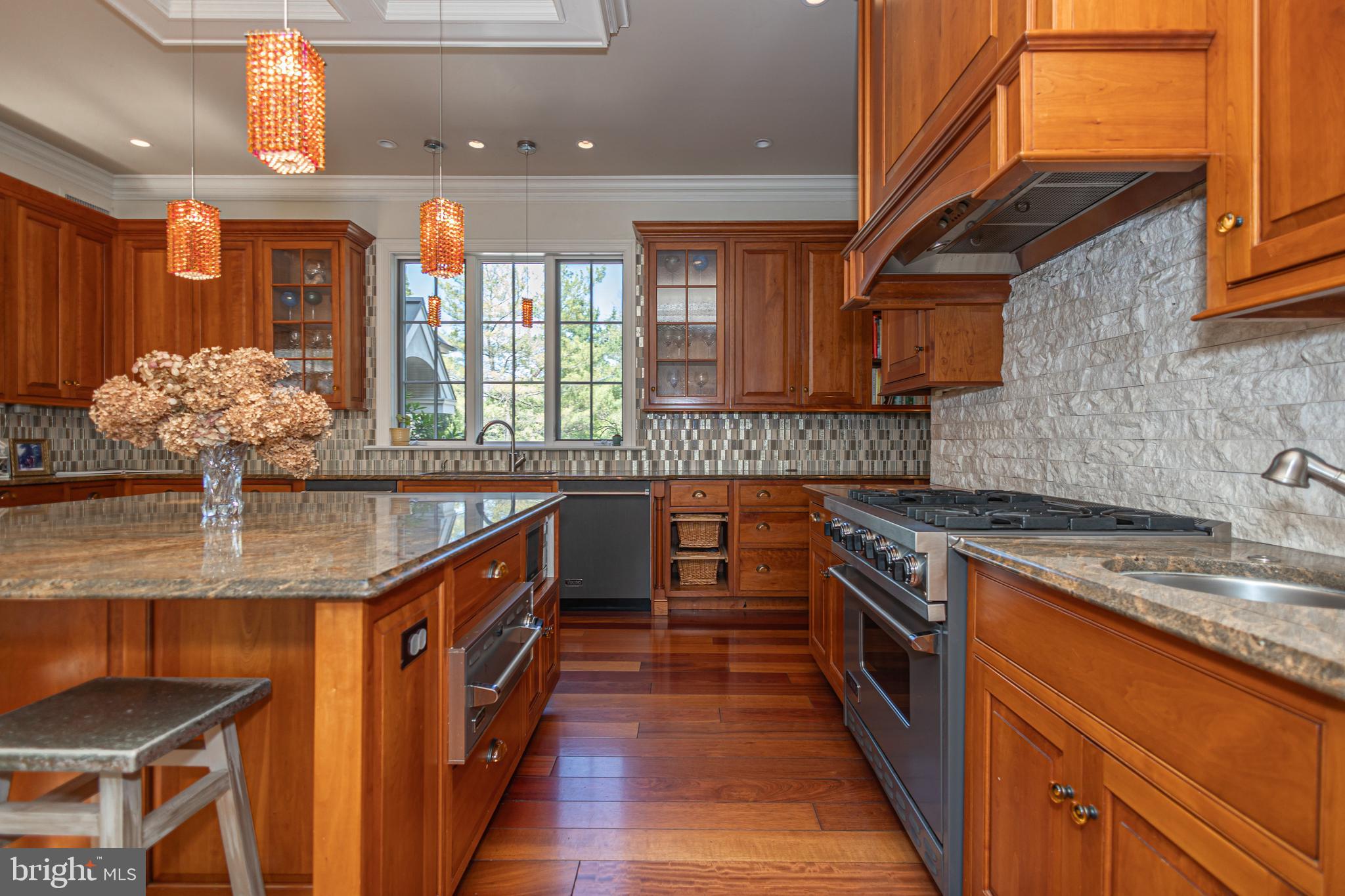5025 Anderson Road Doylestown, PA 18902 - Photo 24 of 92 a kitchen with stainless steel appliances granite countertop a sink a stove and a wooden cabinets