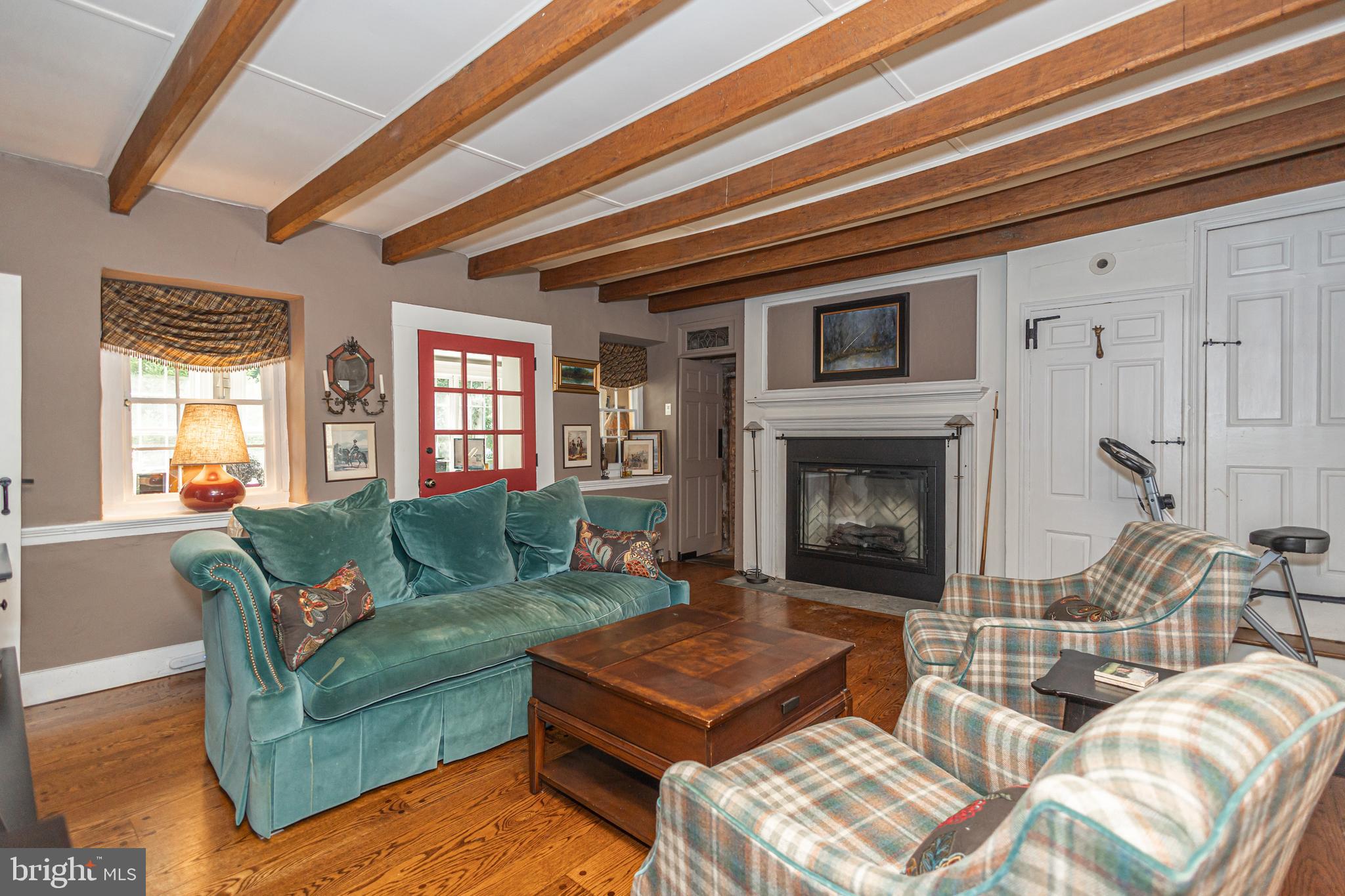 5025 Anderson Road Doylestown, PA 18902 - Photo 43 of 92 a living room with furniture and a fireplace