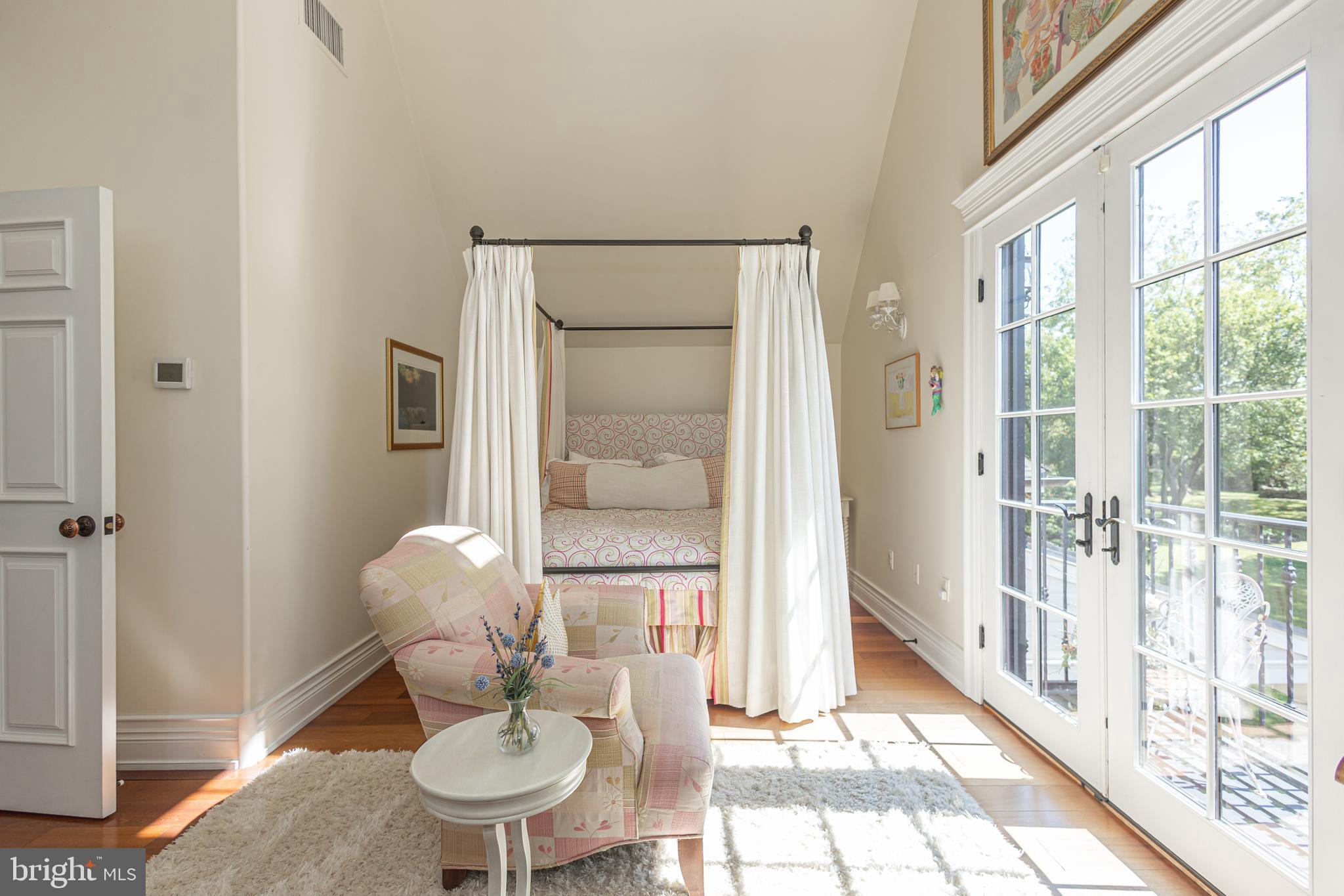 5025 Anderson Road Doylestown, PA 18902 - Photo 59 of 92 a living room with furniture a lamp and a table