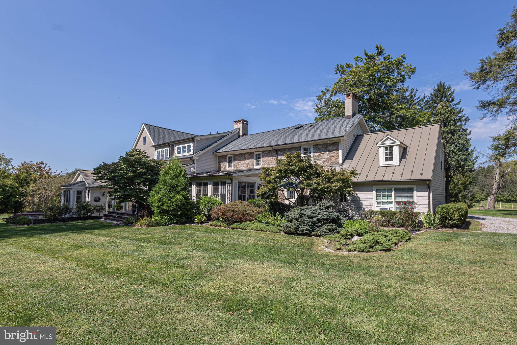 5025 Anderson Road Doylestown, PA 18902 - Photo 61 of 92 a front view of a house with garden