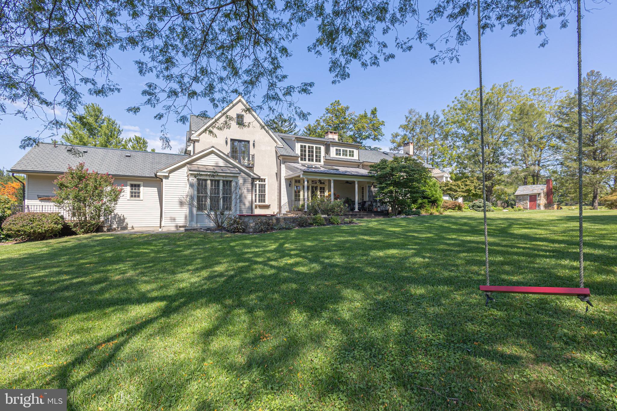 5025 Anderson Road Doylestown, PA 18902 - Photo 64 of 92 a front view of a house with a yard and trees