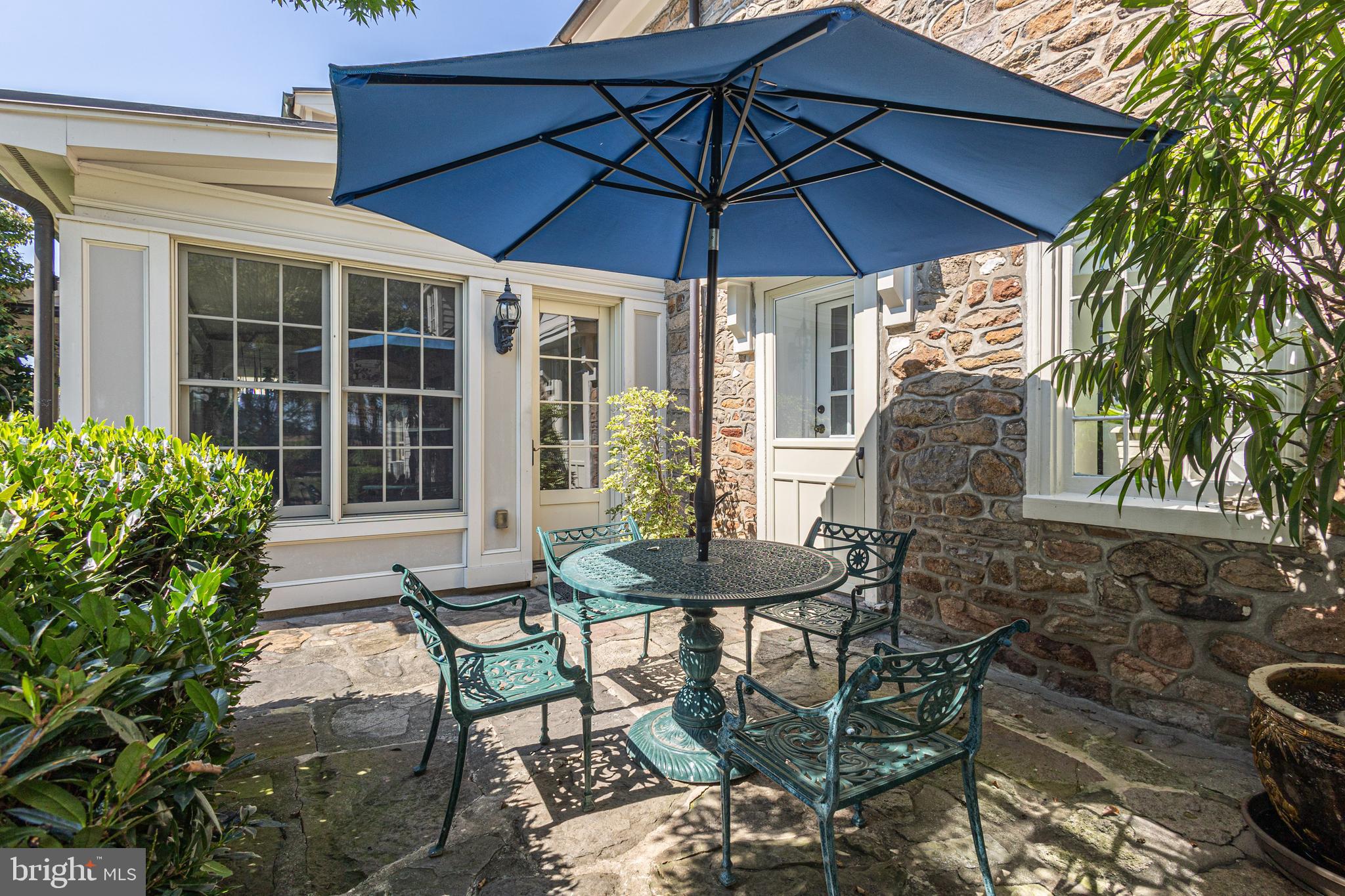 5025 Anderson Road Doylestown, PA 18902 - Photo 70 of 92 a view of a patio with table and chairs under an umbrella