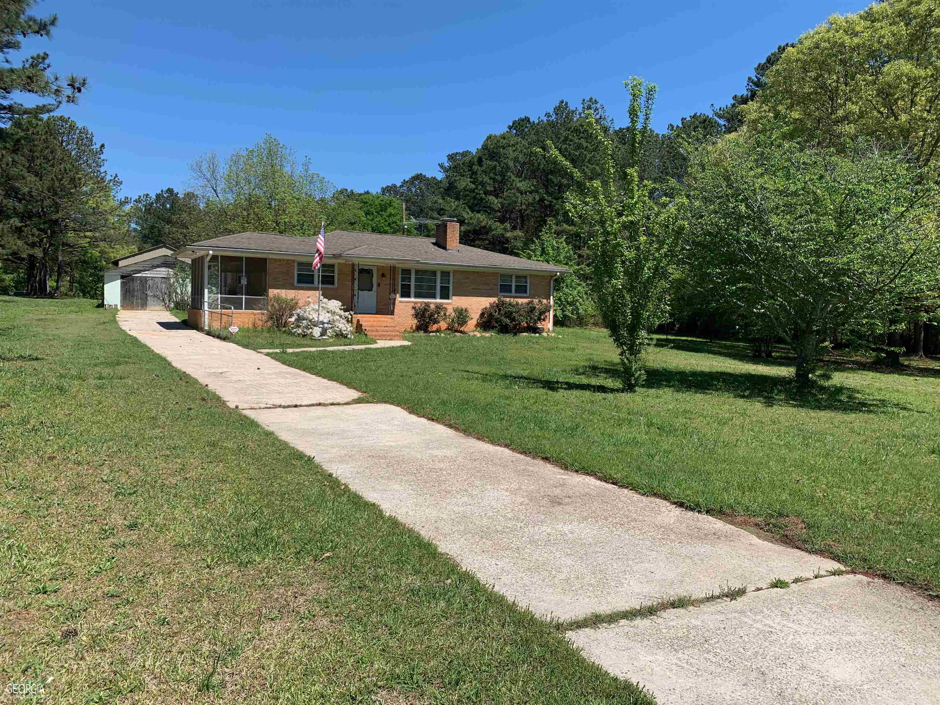 4729 Cook Road Southwest Stockbridge, GA 30281 - Photo 1 of 1 a front view of a house with garden