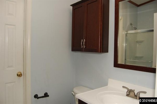 265 Aristocrat Way Reno, NV 89506 - Photo 5 of 7 a bathroom with a sink and a mirror
