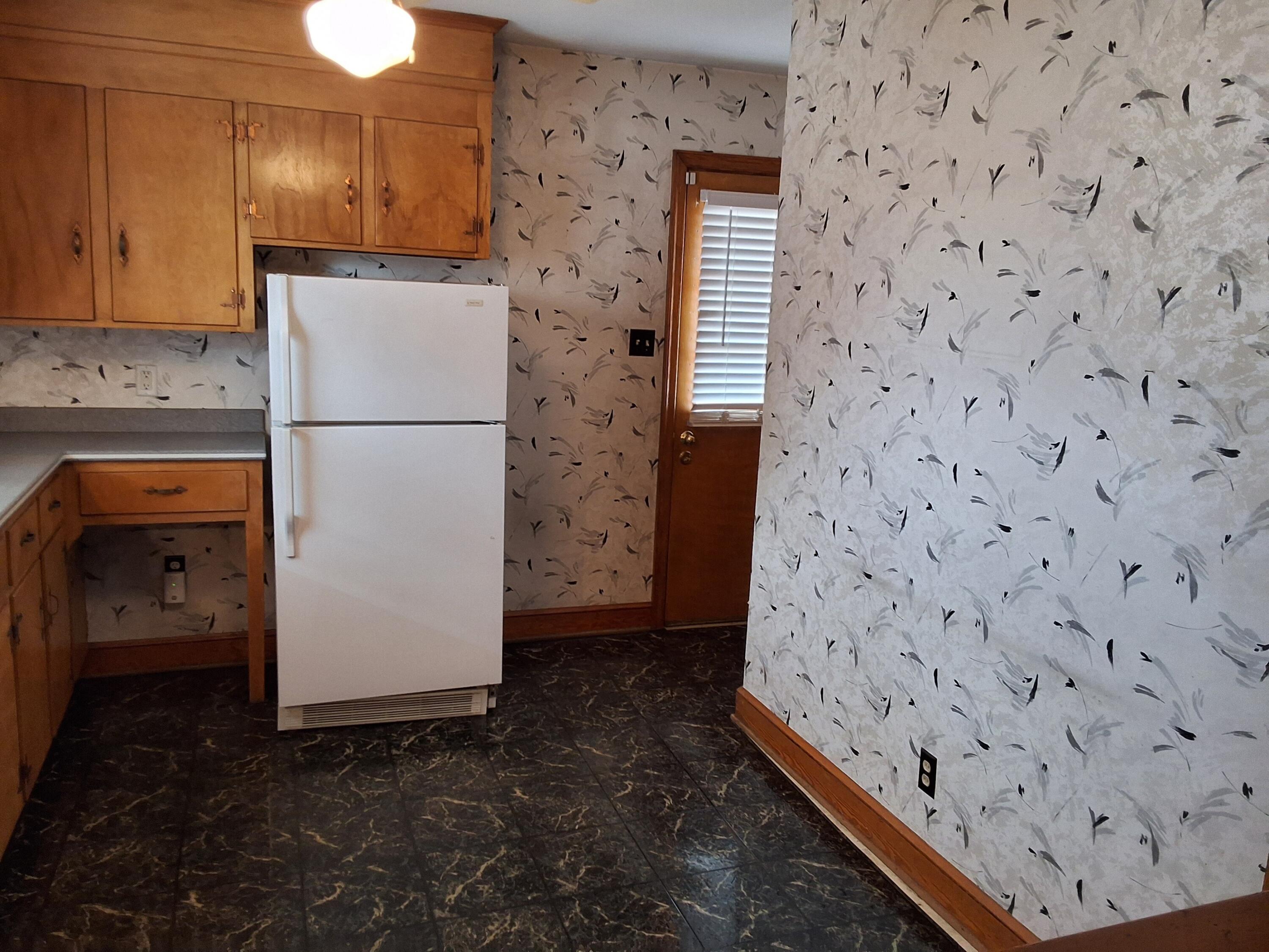 2639 Edgewood Street Southwest Roanoke, VA 24015 - Photo 5 of 12 a kitchen with a refrigerator and a stove