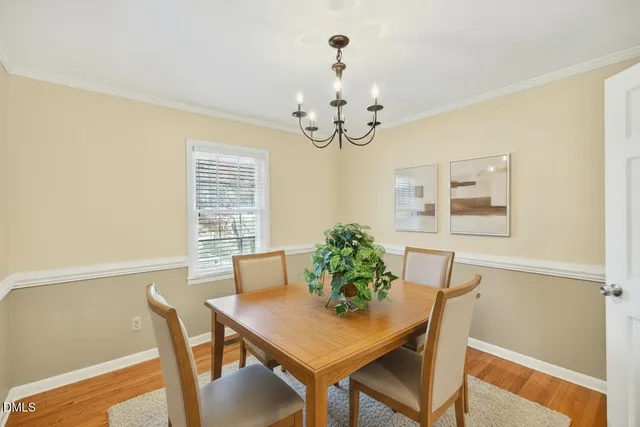 a view of a dining room with furniture and window