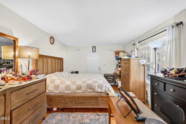 a bed room with a bed and furniture