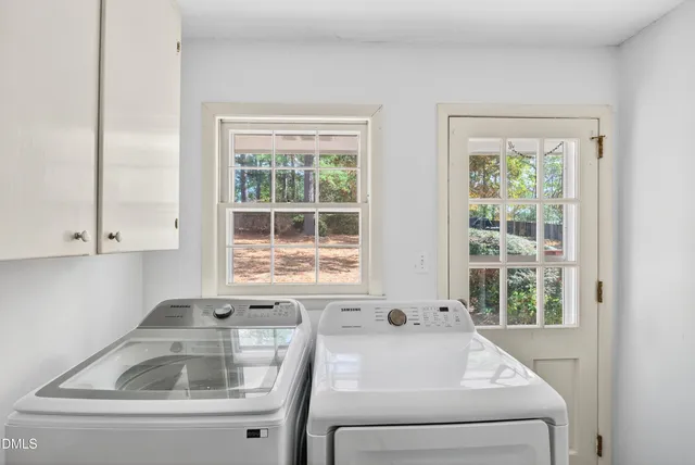 front view of a house with a tree in front of it