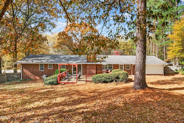 a view of a patio with table and chairs and wooden floor