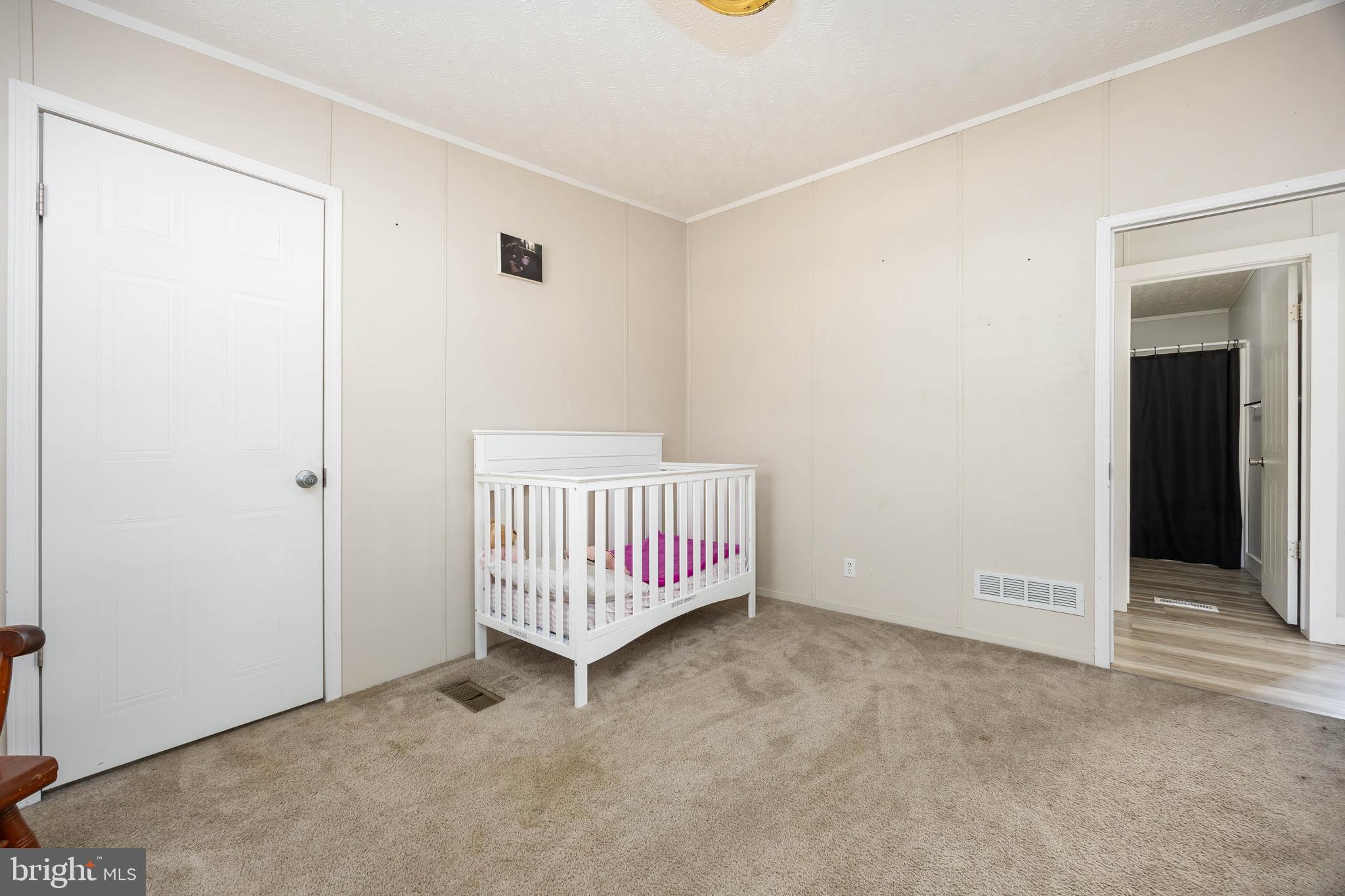 8364 Pittsville Road Parsonsburg, MD 21849 - Photo 30 of 65 an empty room with a ceiling fan and a window