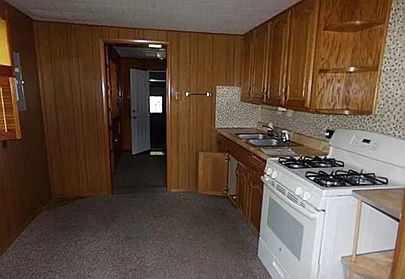 2304 East Division Street Decatur, IL 62526 - Photo 3 of 19 a kitchen with a stove and a refrigerator