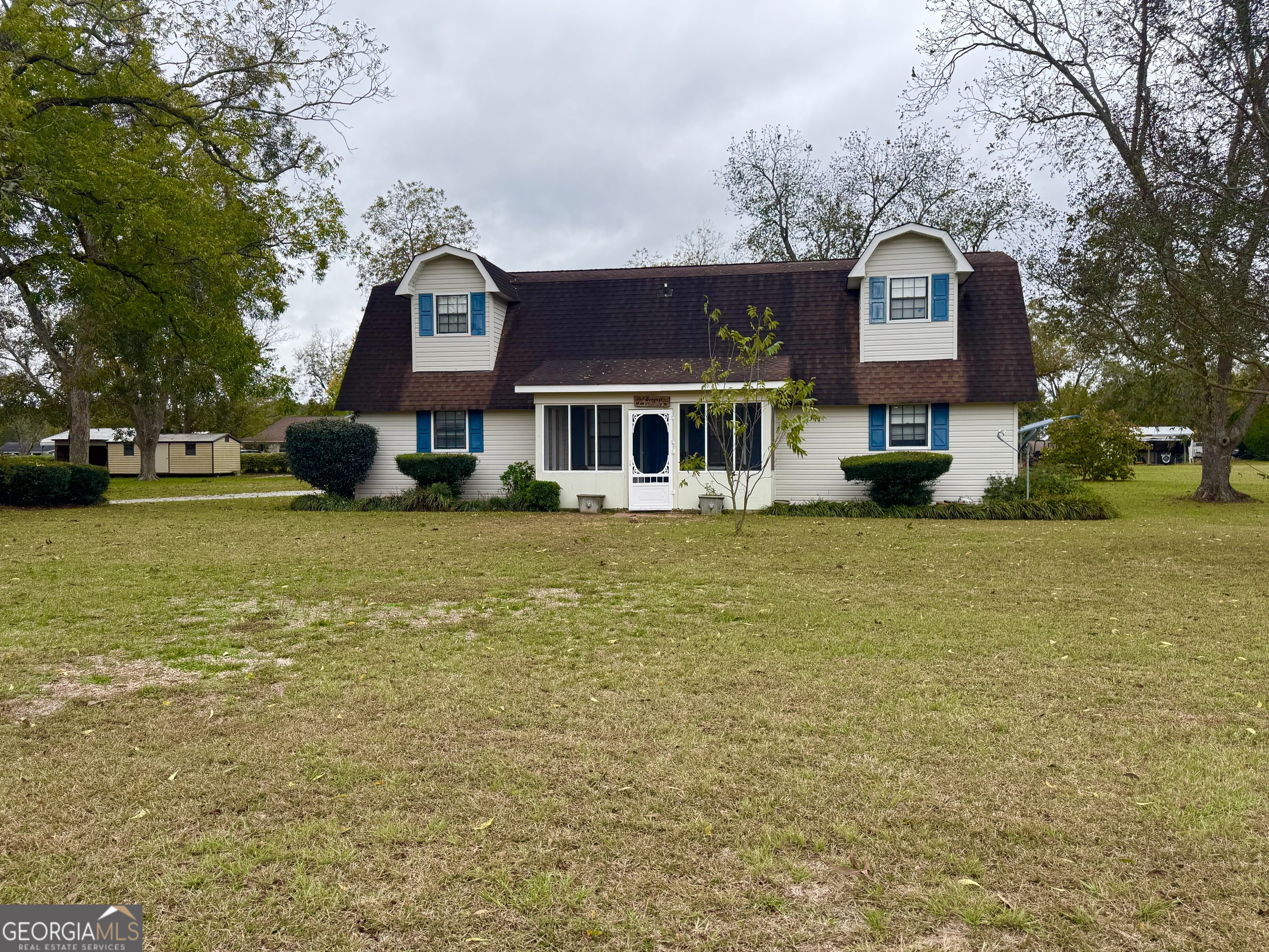 a front view of a building with garden