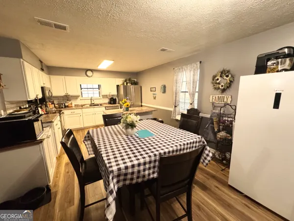 a view of a dining room with furniture