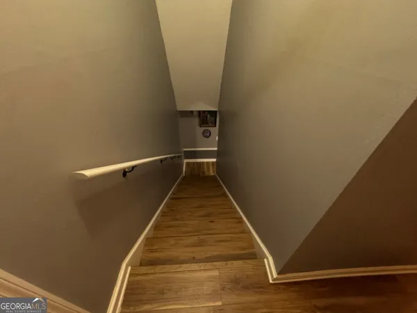 a view of balcony with wooden floor