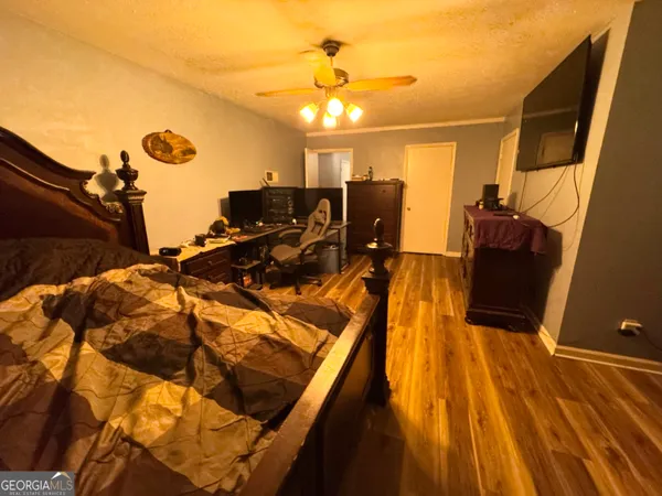 a bed room with a bed and a chandelier