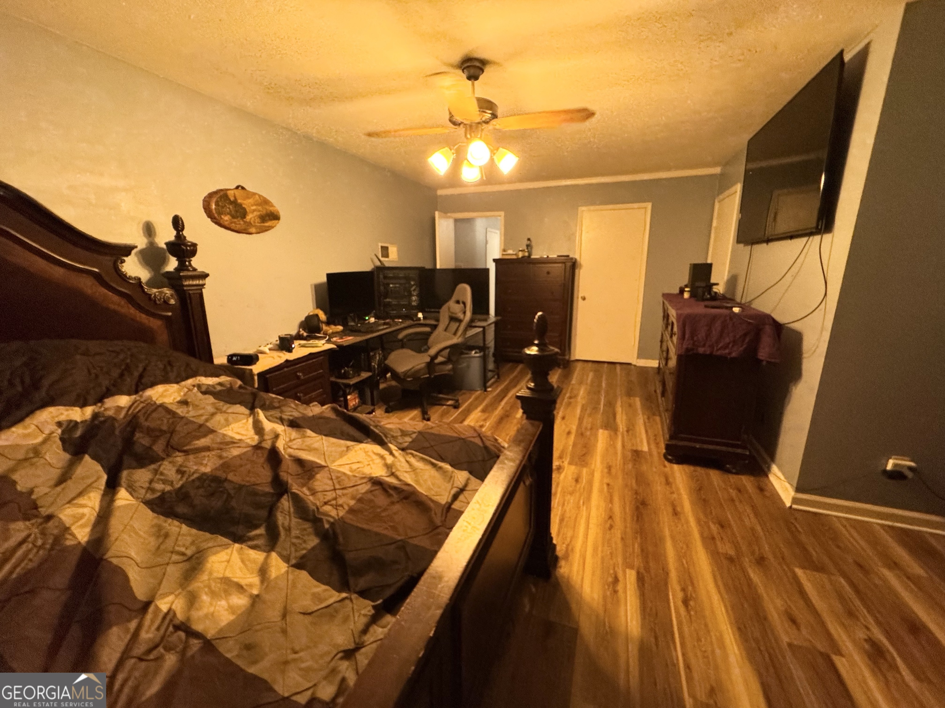 509 Lakeview Drive Dexter, GA 31019 - Photo 28 of 41 a bed room with a bed and a chandelier