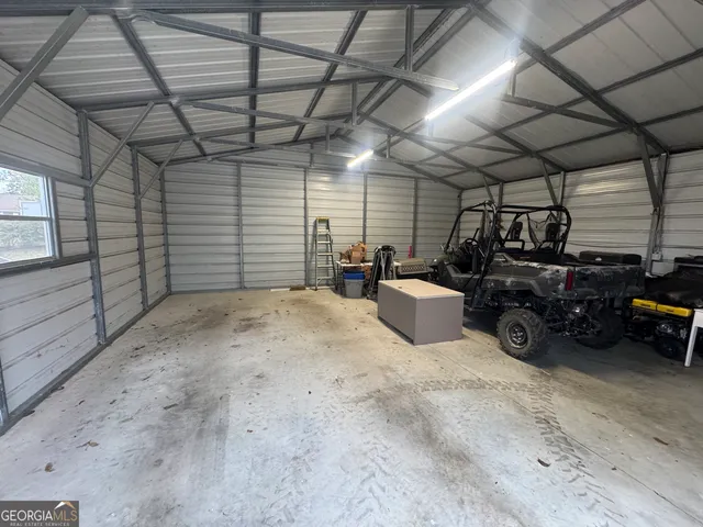 a view of a garage with a car parked