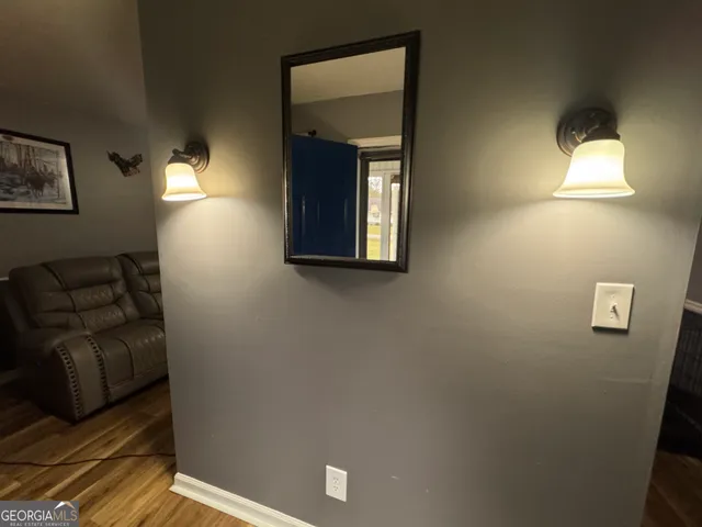 a view of livingroom with furniture and a window