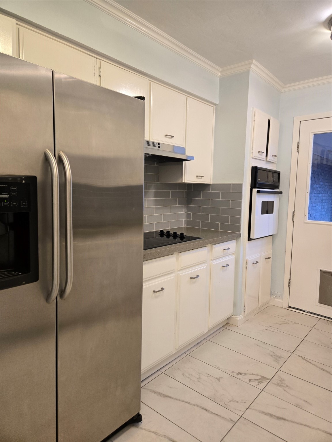 1517 Ramada Drive, Unit 1517 Houston, TX 77062 - Photo 3 of 19 a kitchen with stainless steel appliances cabinets and a counter top space