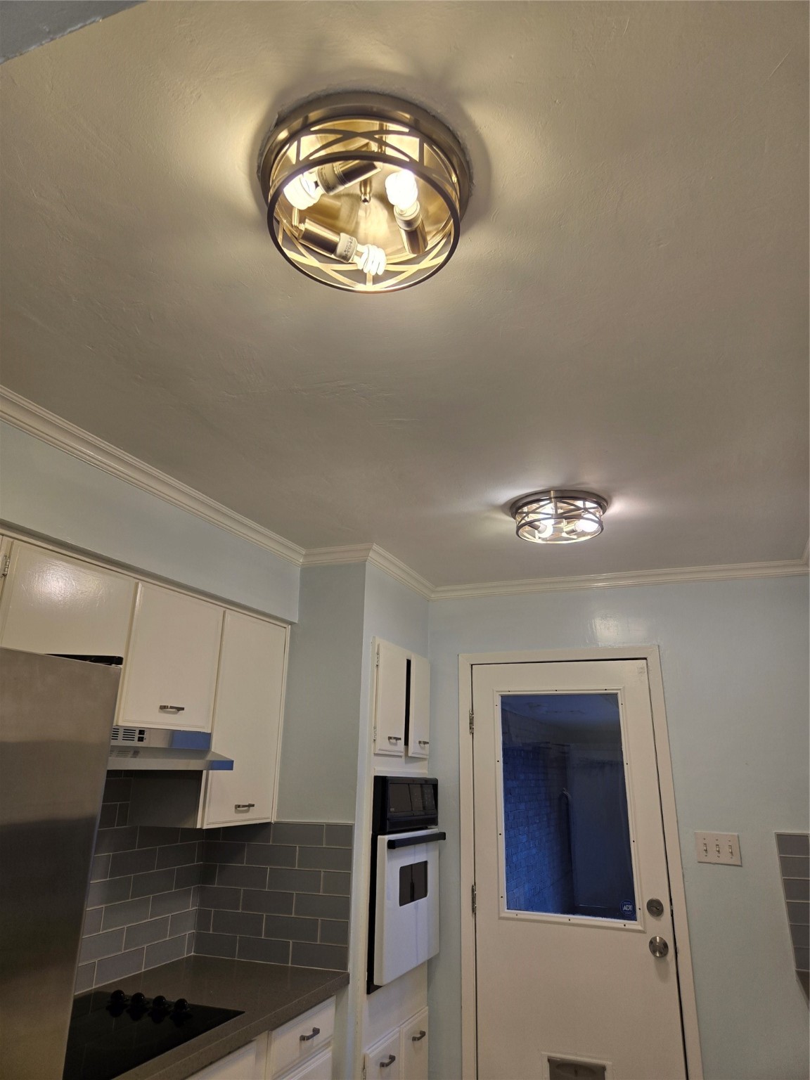 1517 Ramada Drive, Unit 1517 Houston, TX 77062 - Photo 4 of 19 an empty room with wooden floor and chandelier