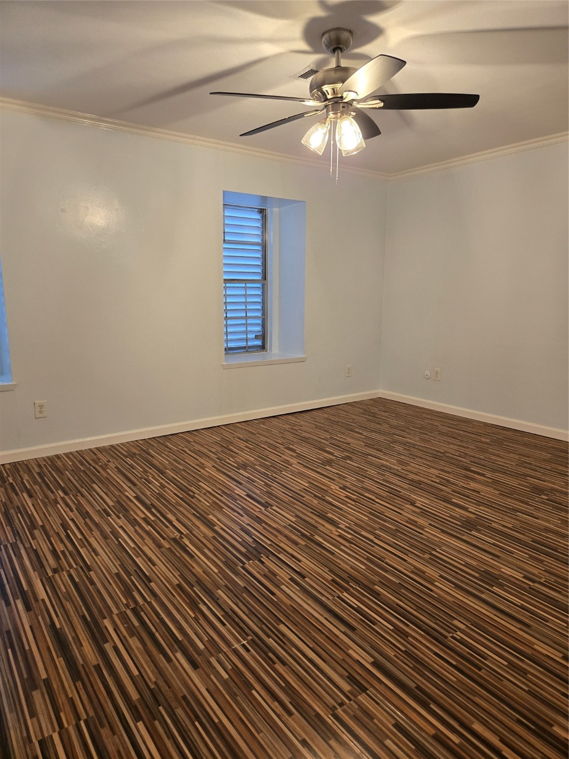 1517 Ramada Drive, Unit 1517 Houston, TX 77062 - Photo 6 of 19 a view of a room with wooden floor and a fan