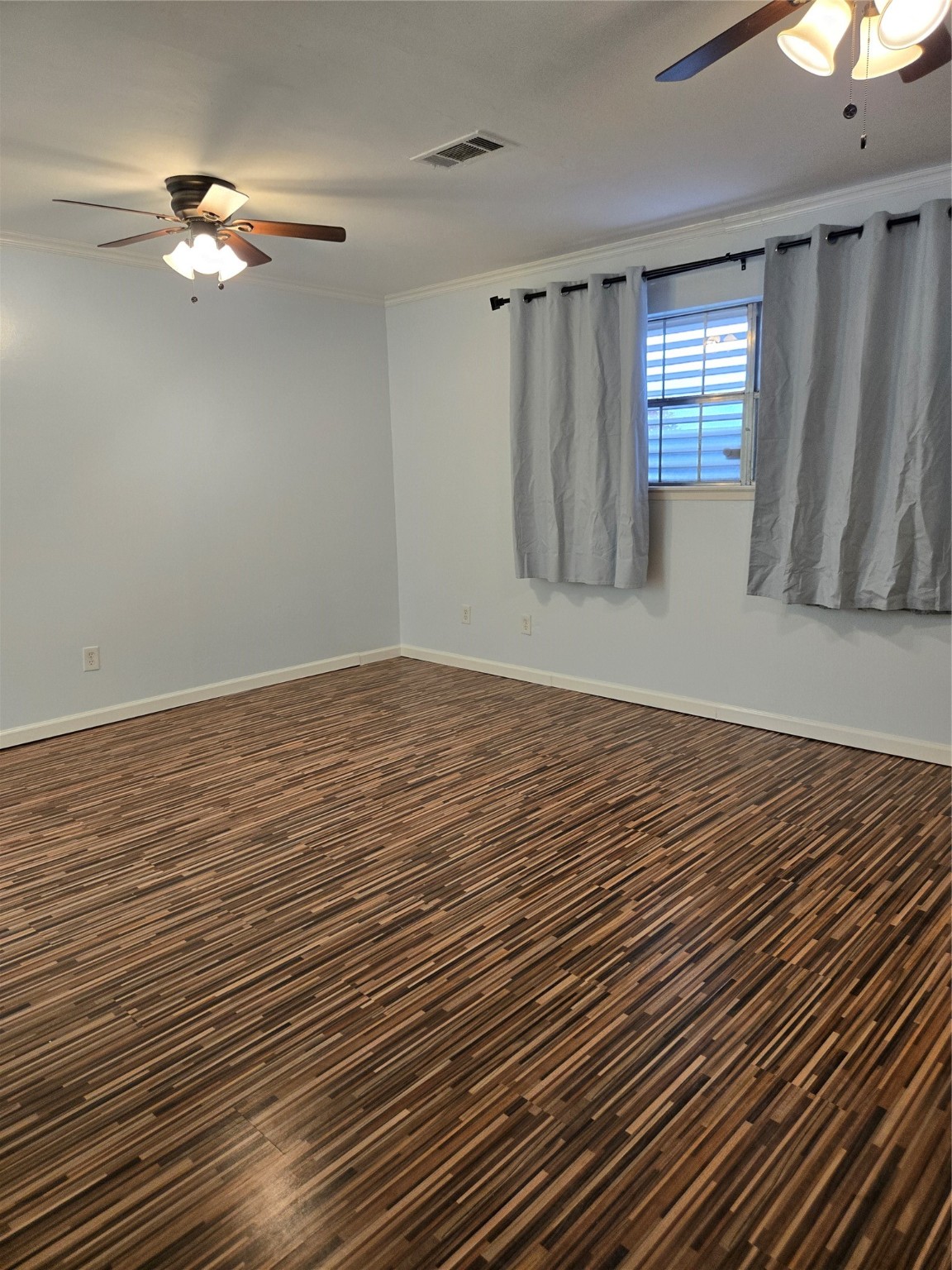 1517 Ramada Drive, Unit 1517 Houston, TX 77062 - Photo 7 of 19 wooden floor in an empty room with a window