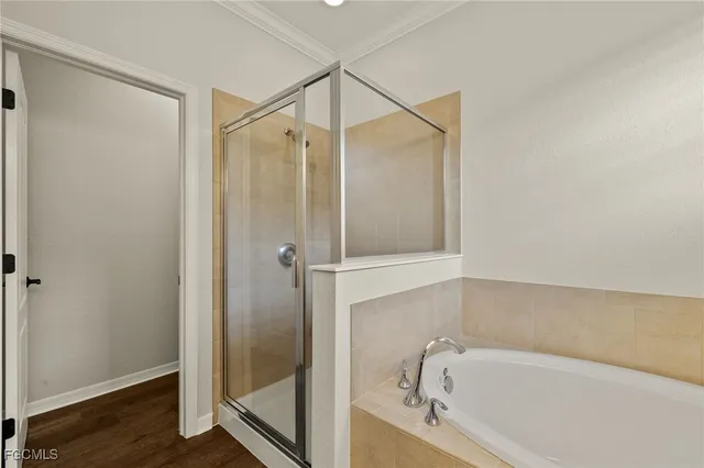 a bathroom with a bathtub and shower