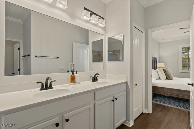 a en suite bathroom with double sink and a mirror