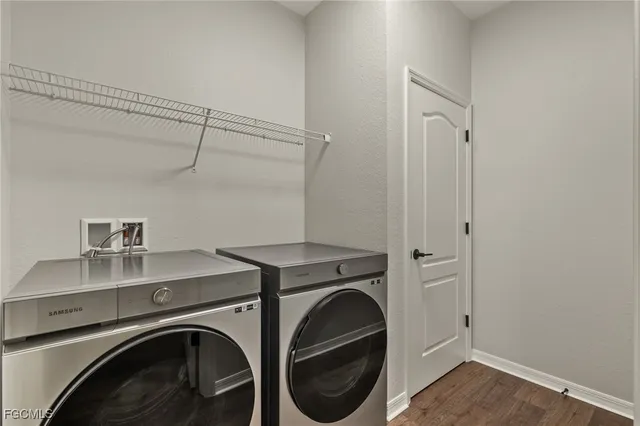 a utility room with dryer and washer