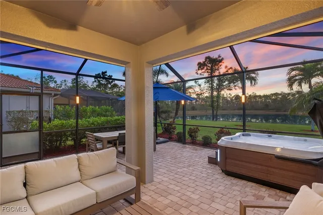 a backyard of a house with barbeque oven table and chairs