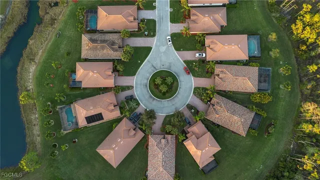 an aerial view of residential house with outdoor space and swimming pool