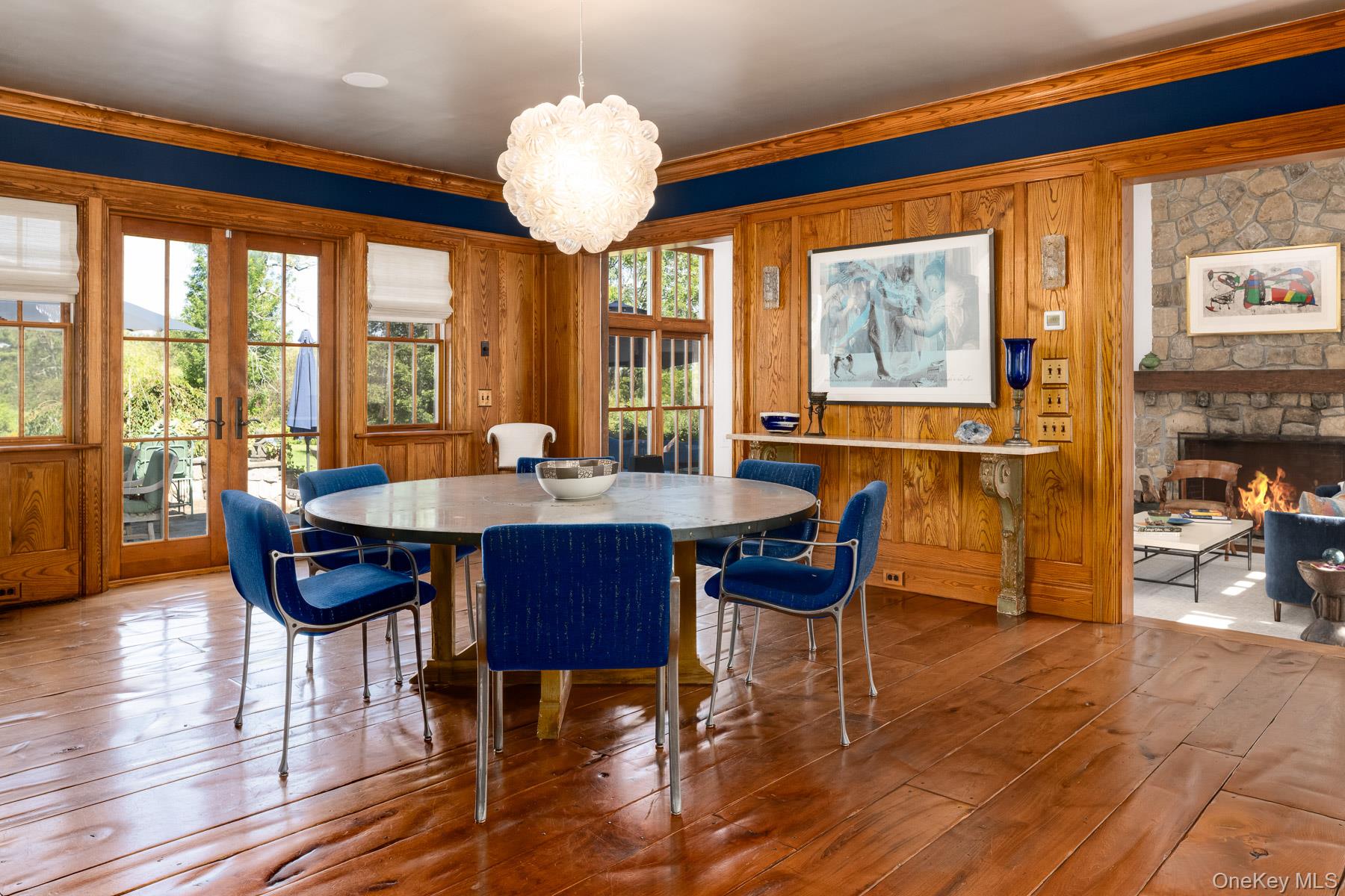 11 Carriage House Road Waccabuc, NY 10597 - Photo 12 of 39 a dining room with furniture a chandelier and wooden floor