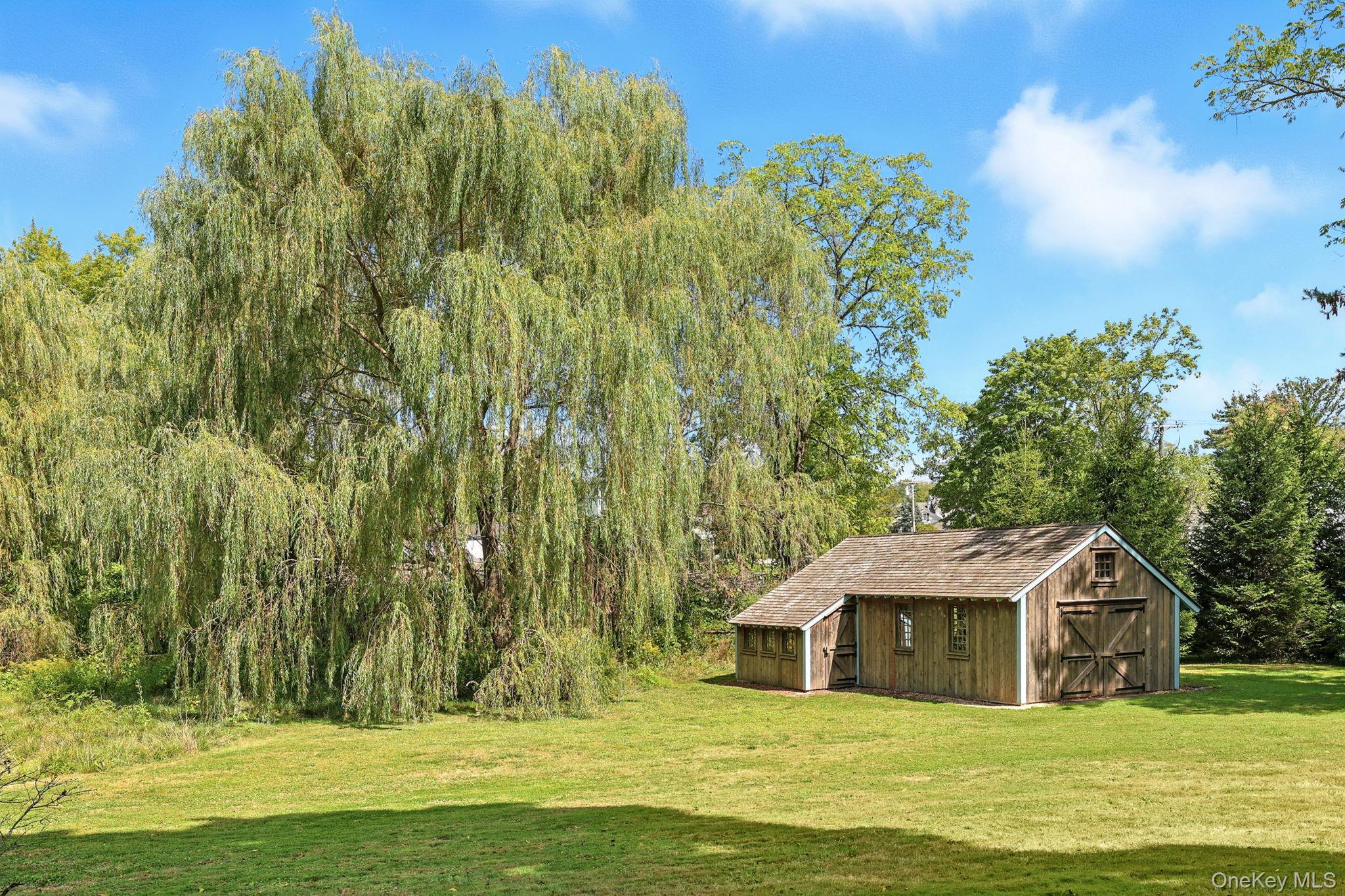 11 Carriage House Road Waccabuc, NY 10597 - Photo 32 of 39 a view of a house with a swimming pool