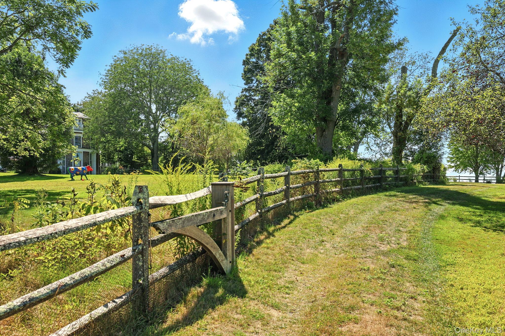 11 Carriage House Road Waccabuc, NY 10597 - Photo 34 of 39 a view of a swimming pool with a garden and trees