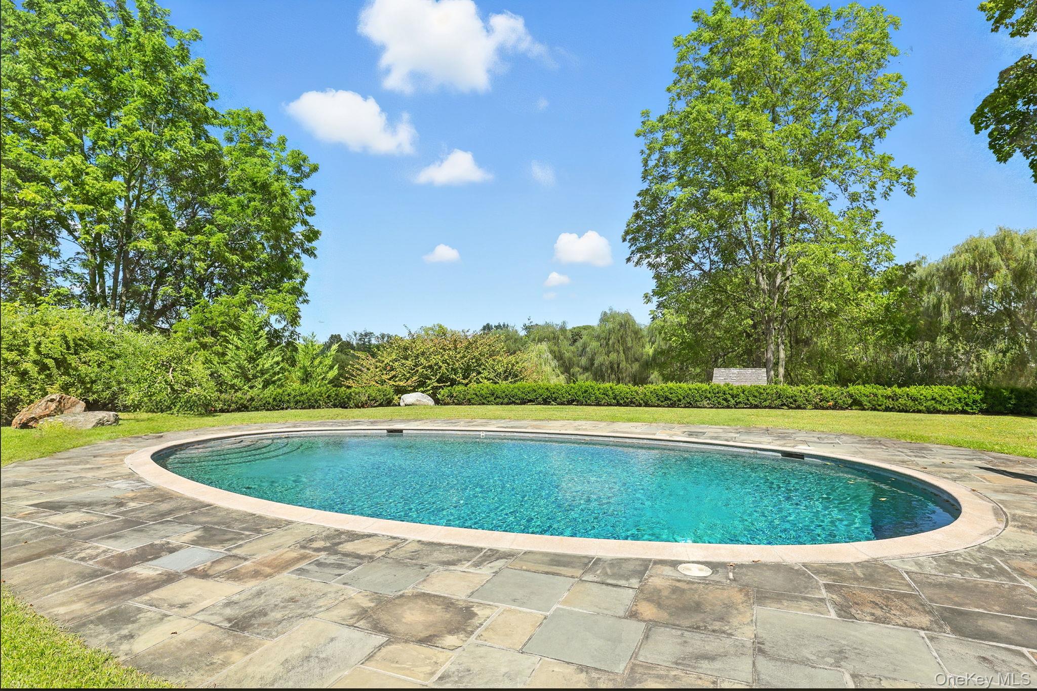 11 Carriage House Road Waccabuc, NY 10597 - Photo 36 of 39 a view of a swimming pool and a yard