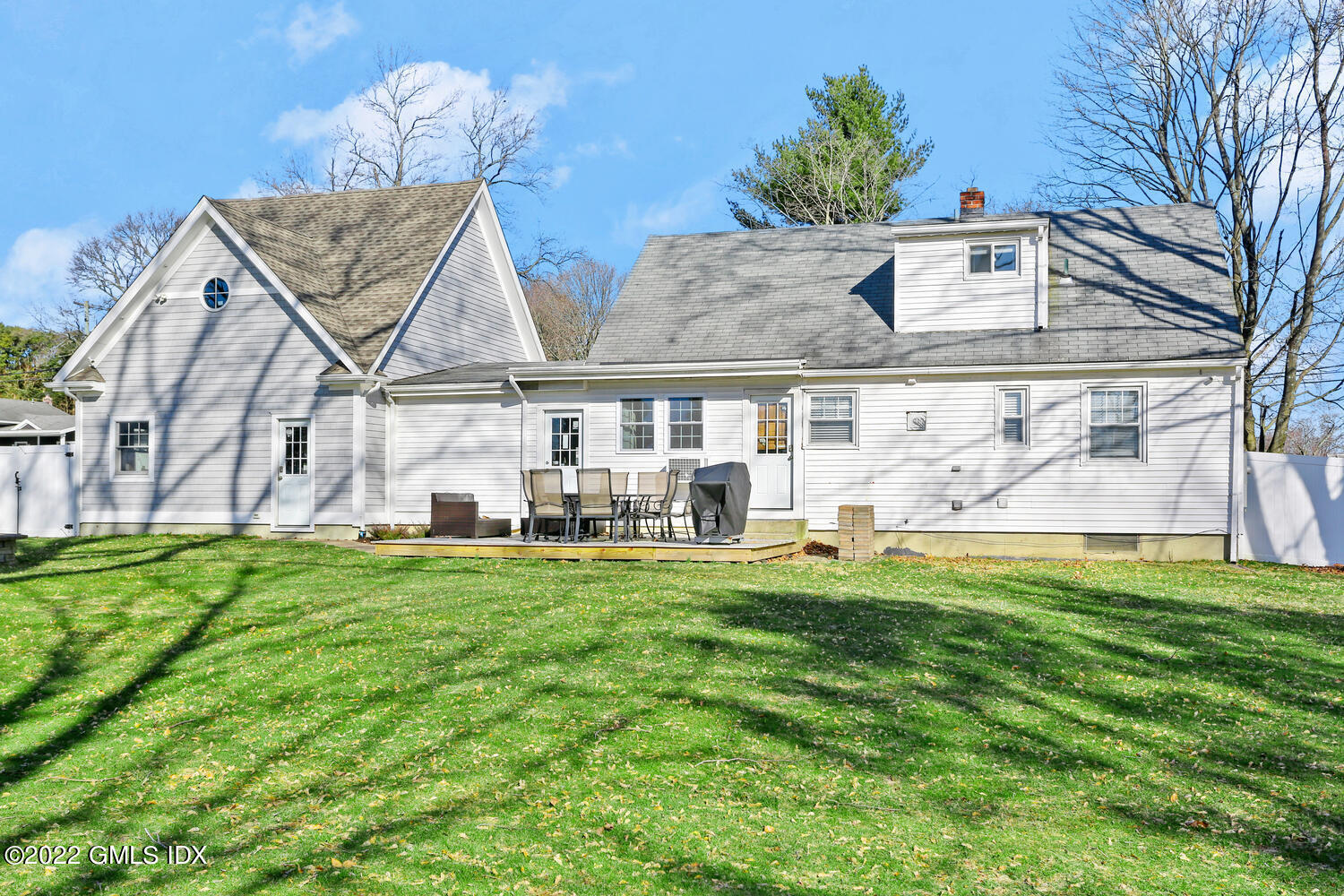 16 Esquire Road Norwalk, CT 06851 - Photo 25 of 33 a backyard of a house with table and chairs