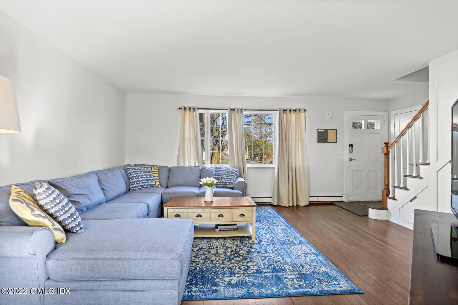 16 Esquire Road Norwalk, CT 06851 - Photo 3 of 33 a living room with furniture and a rug