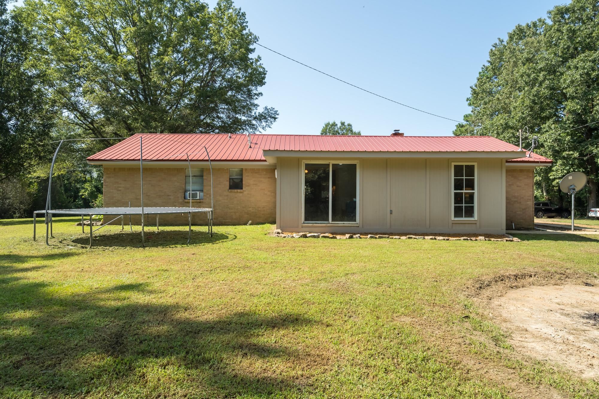 2484 Bryan Road Michigan City, MS 38647 - Photo 29 of 31 a view of a house with a yard and sitting area
