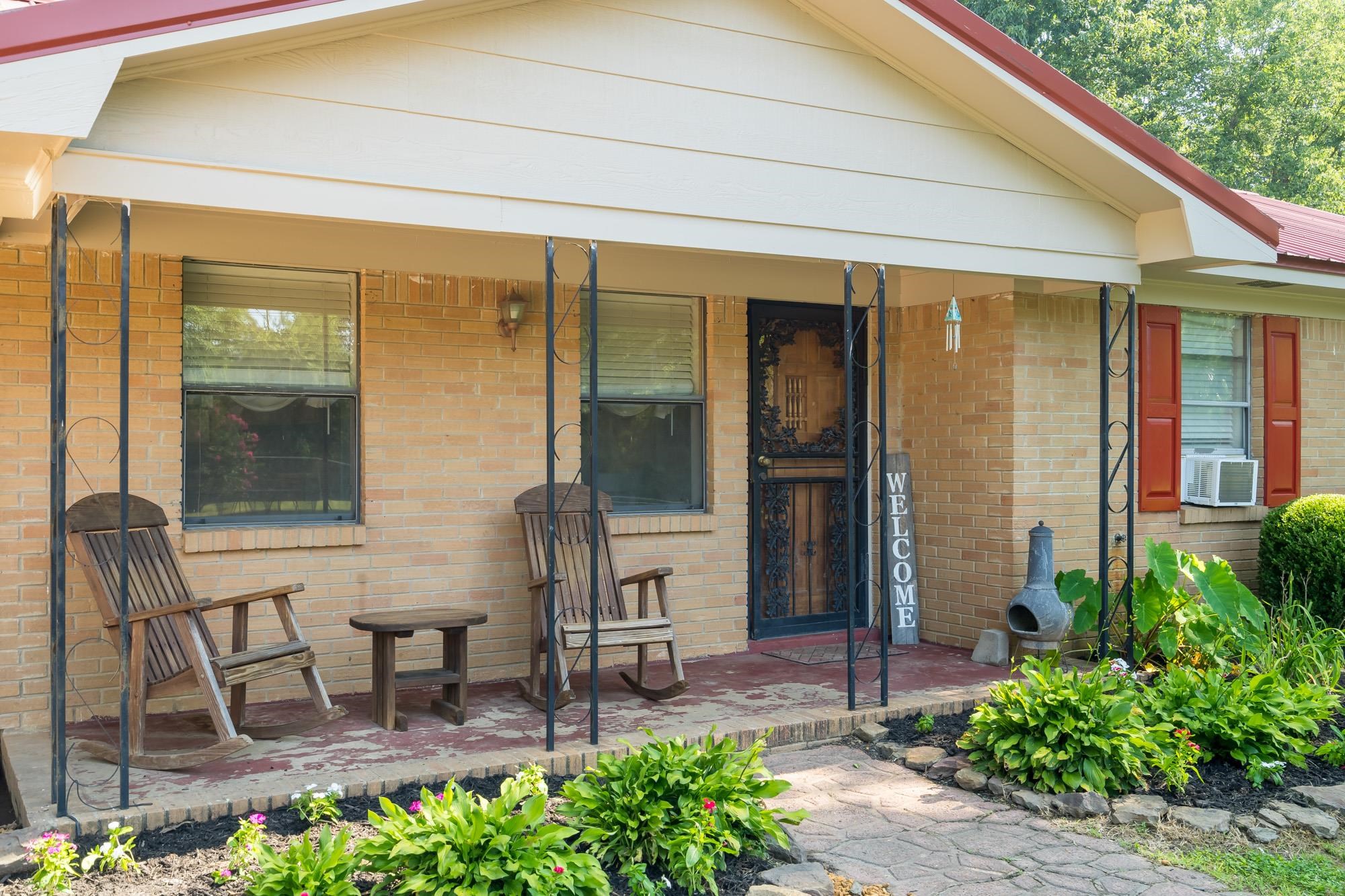 2484 Bryan Road Michigan City, MS 38647 - Photo 5 of 31 a view of a patio with table and chairs and potted plants