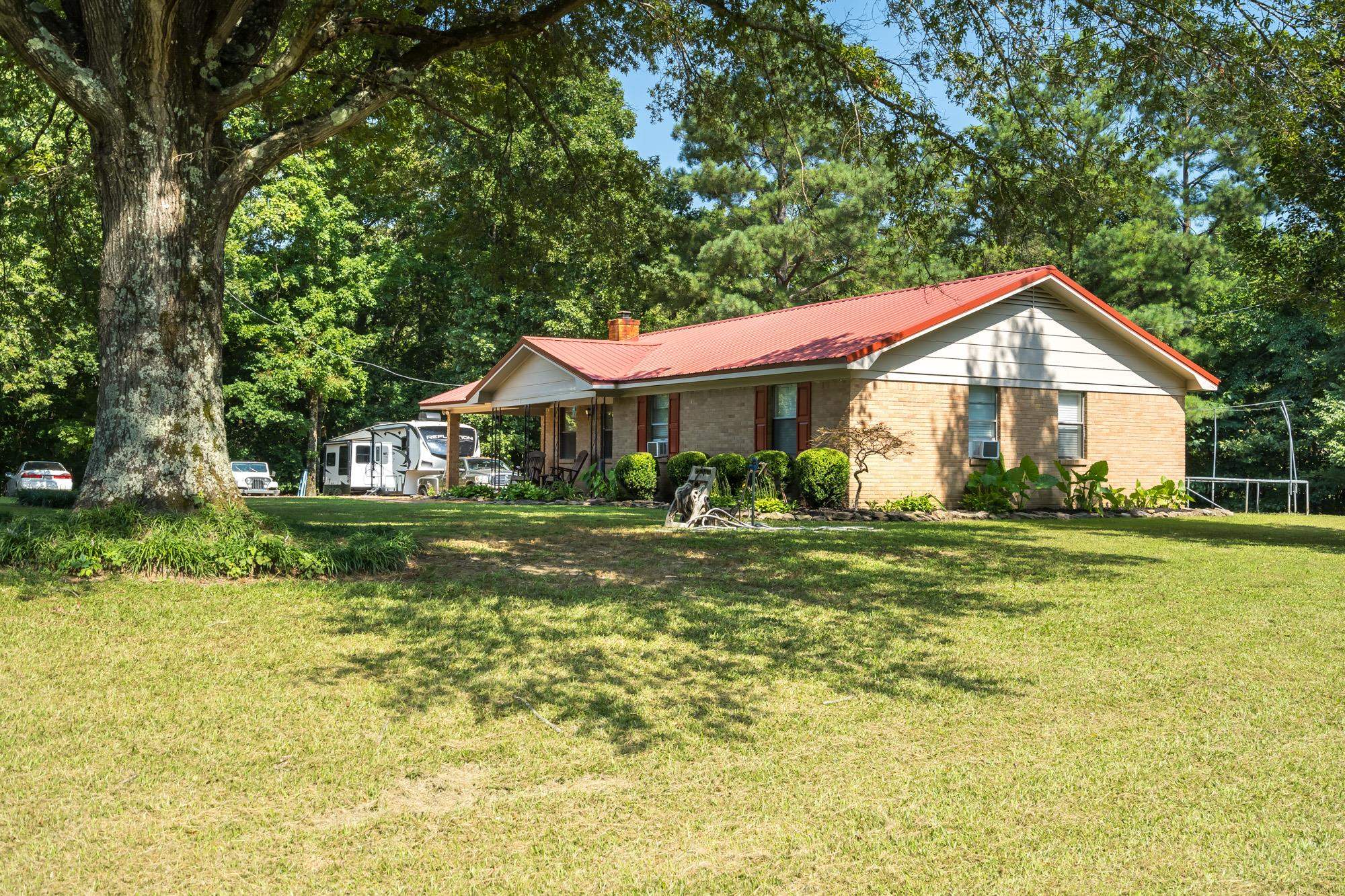 2484 Bryan Road Michigan City, MS 38647 - Photo 7 of 31 a front view of a house with garden
