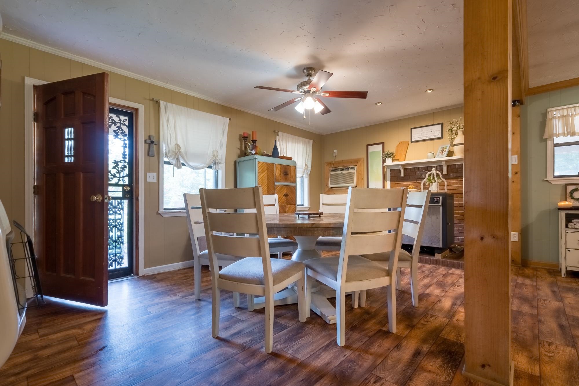 2484 Bryan Road Michigan City, MS 38647 - Photo 8 of 31 a dining room with furniture a chandelier and wooden floor