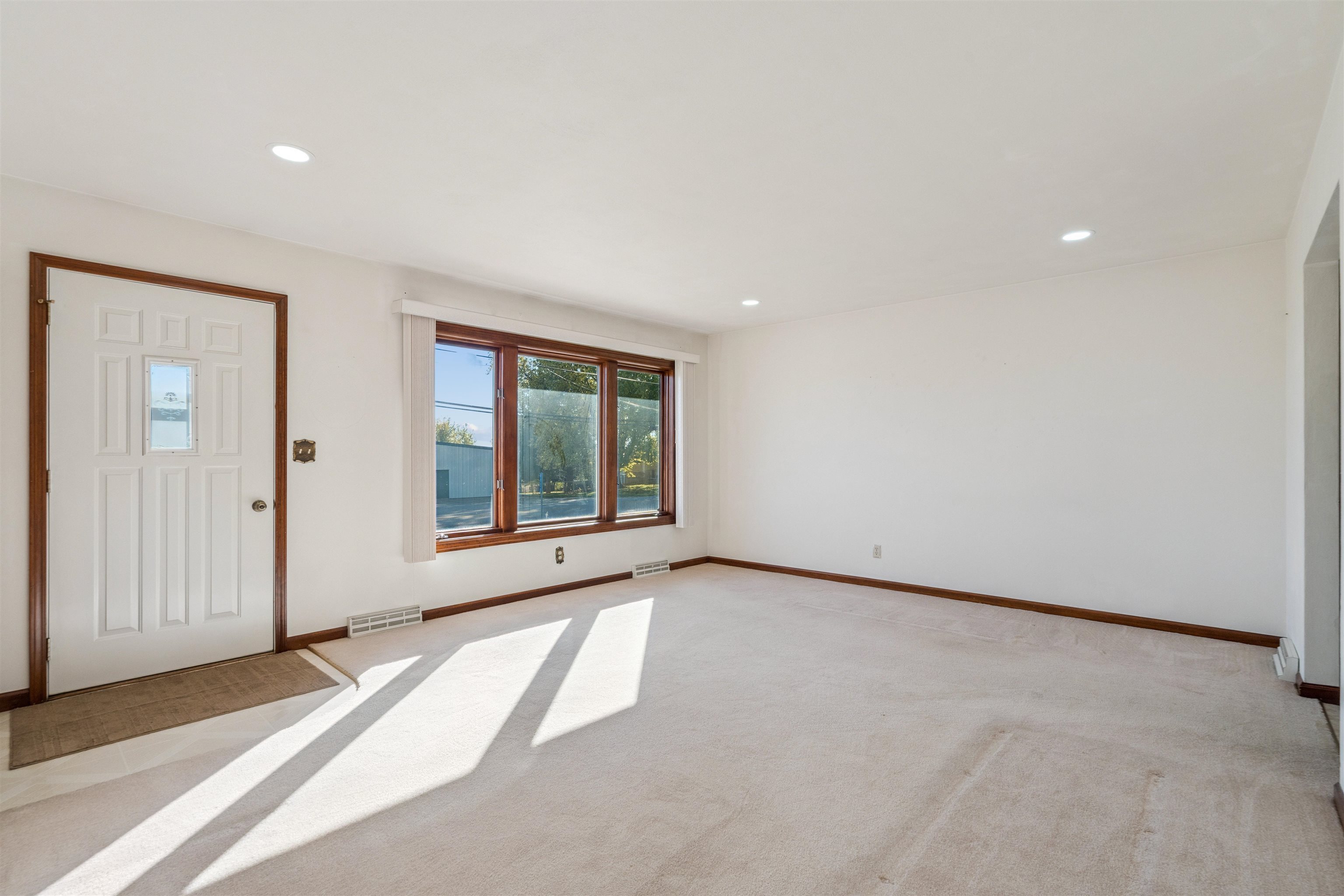 8920 Badger Road East Dubuque, IL 61025 - Photo 3 of 15 a view of an empty room with a window