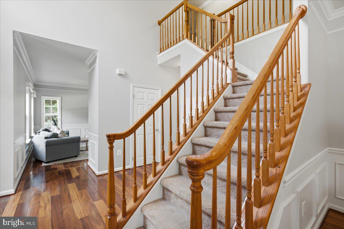 2424 Springbrook Court Huntingtown, MD 20639 - Photo 18 of 103 a view of entryway with wooden floor and stairs