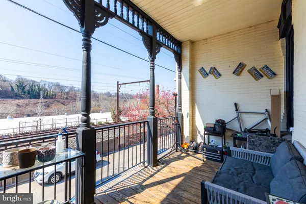 a view of a living room and a balcony