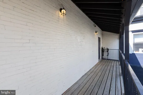 a view of balcony with wooden floor