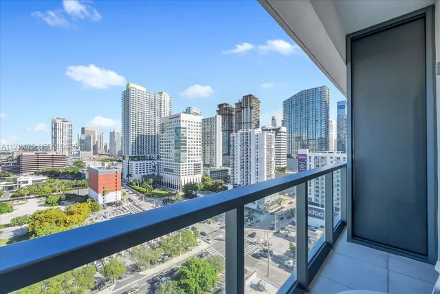 a view of a living room and kitchen