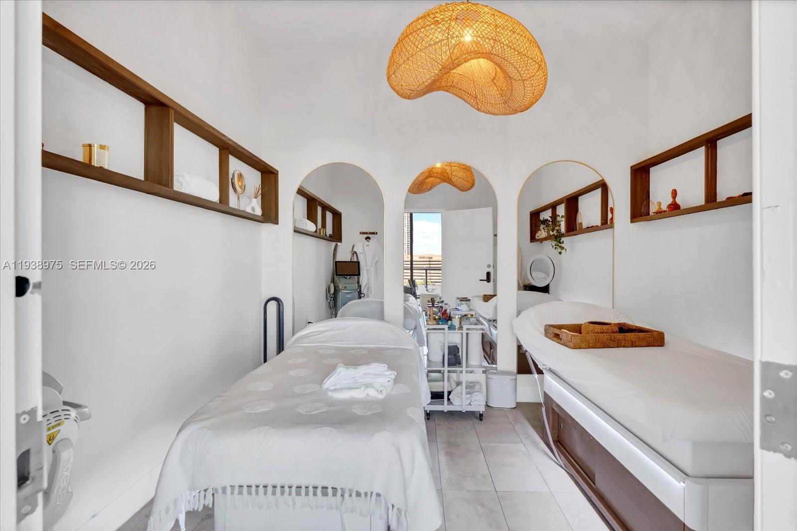 239 Southwest 9th Street, Unit 1603 Miami, FL 33130 - Photo 22 of 29 a bedroom with bed and a large mirror